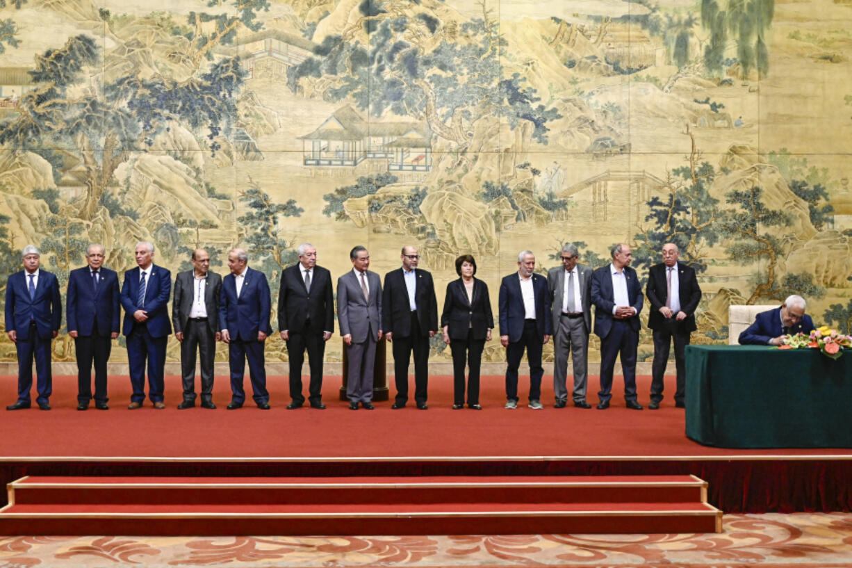 China&rsquo;s Foreign Minister Wang Yi, center, look on during an event for Fatah and Hamas in signing the &ldquo;Beijing declaration&rdquo; at the Diaoyutai State Guesthouse  in Beijing, Tuesday, July 23, 2024.