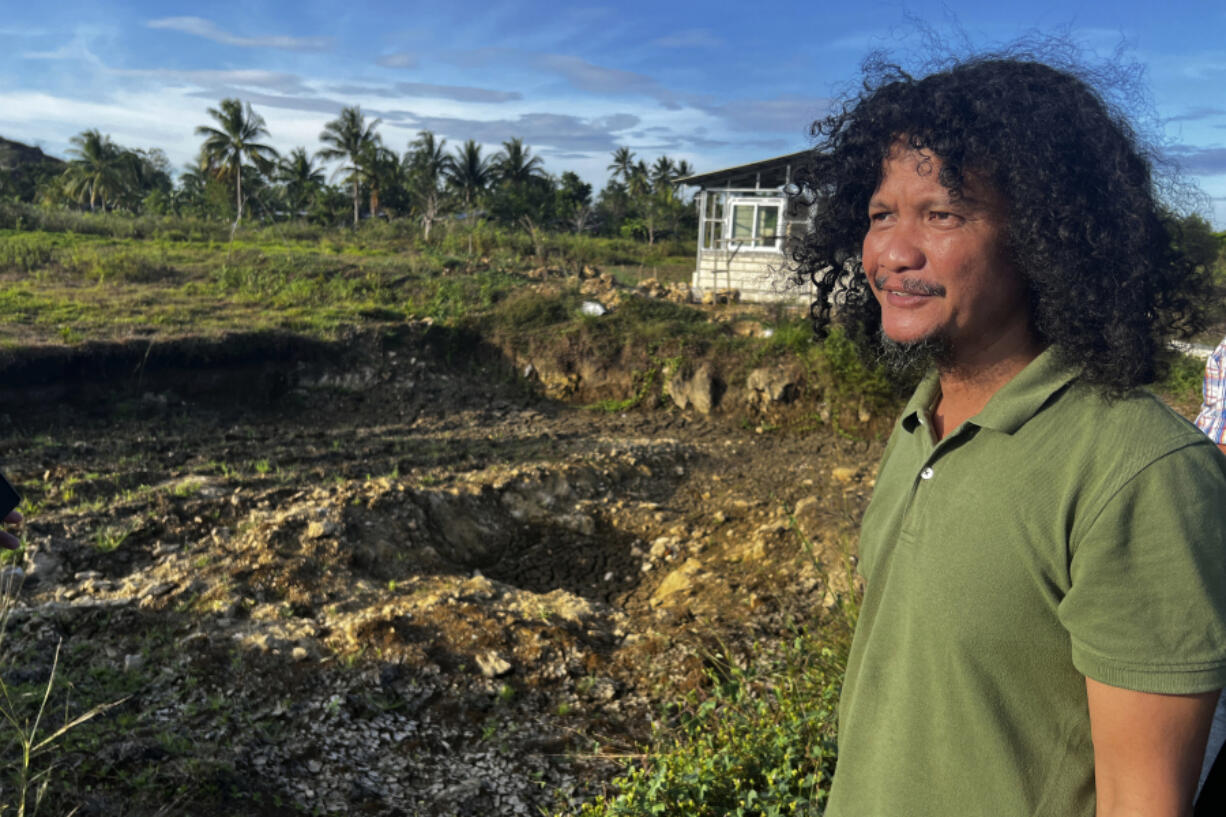 Joel Diccion, a farmer, poses for a photo in Carmen, Philippines, May 6, 2024. A growing type of insurance, called parametric insurance, is helping farmers like Diccion and others in developing countries respond to extreme weather events.