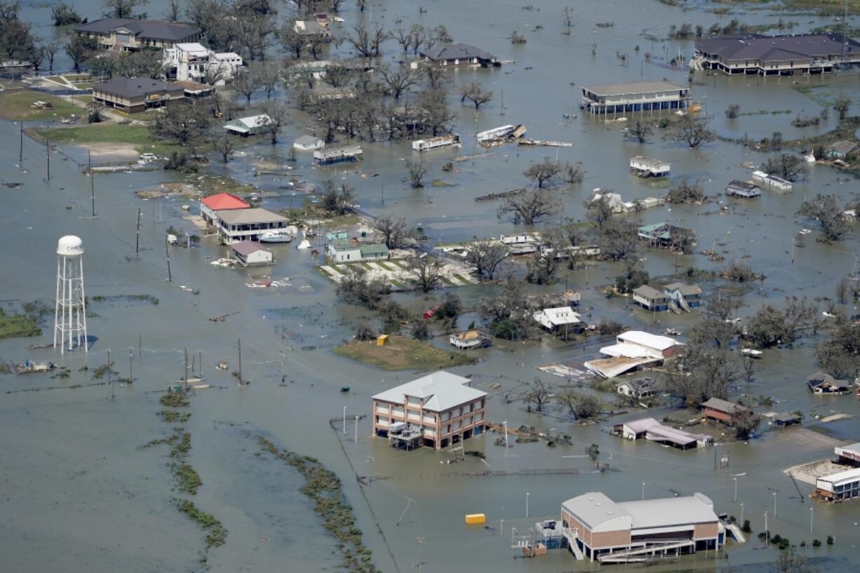 Buildings and homes are flooded Aug. 27, 2020, in the aftermath of Hurricane Laura near Lake Charles, La. (David J.