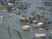 Buildings and homes are flooded Aug. 27, 2020, in the aftermath of Hurricane Laura near Lake Charles, La. (David J.