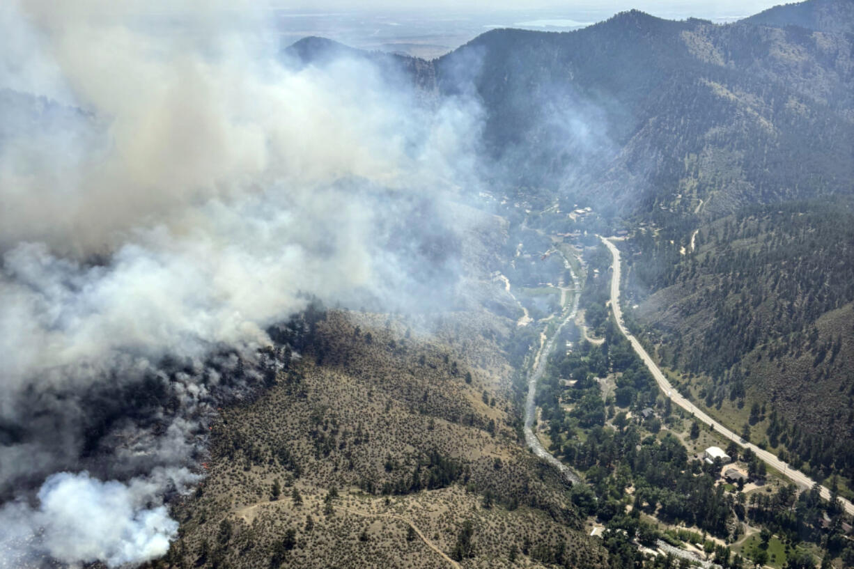 This image provided by the USDA Forest Service shows the Alexander Mountain Fire near Loveland, Colo., Tuesday, July 30, 2024.