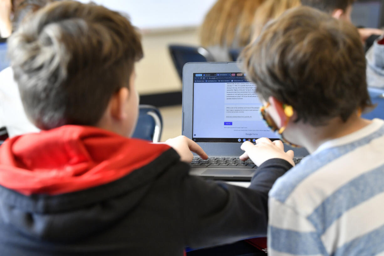 Students work on a laptop computer at Stonewall Elementary in Lexington, Ky., on Feb. 6, 2023. A bill aiming to protect children from the harms of social media, gaming sites and other online platforms appears to have enough bipartisan support to pass. (Timothy D.