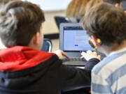 Students work on a laptop computer at Stonewall Elementary in Lexington, Ky., on Feb. 6, 2023. A bill aiming to protect children from the harms of social media, gaming sites and other online platforms appears to have enough bipartisan support to pass. (Timothy D.