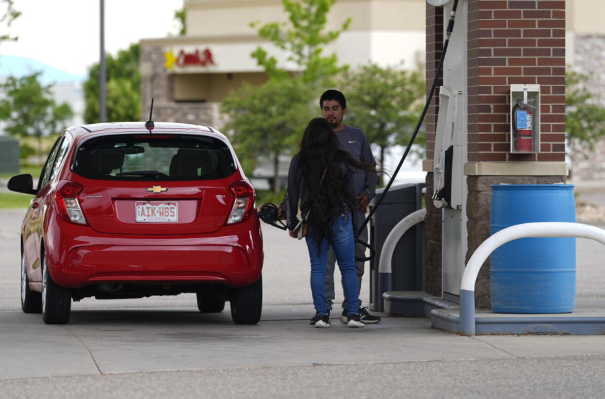 Motorists fill up the tank of a car at a gasoline station on Tuesday, June 25, 2024, in Loveland, Colo. On Thursday, July 11, 2024, the Labor Department issues its report on inflation at the consumer level in June.