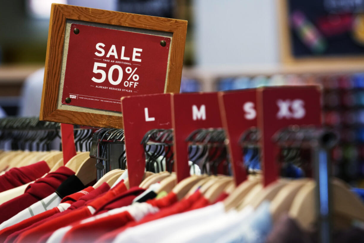 A sale sign is displayed on a rack of clothes at a store in Chicago, Monday, June 10, 2024. On Thursday, July 11, 2024, the Labor Department issues its report on inflation at the consumer level in June. (AP Photo/Nam Y.