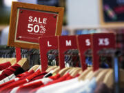 A sale sign is displayed on a rack of clothes at a store in Chicago, Monday, June 10, 2024. On Thursday, July 11, 2024, the Labor Department issues its report on inflation at the consumer level in June. (AP Photo/Nam Y.