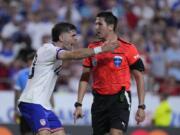 Christian Pulisic, left, of the United States, argues a non-call during a Copa America Group C soccer match against Uruguay, Monday, July 1, 2024, in Kansas City, Mo.
