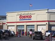 FILE - People enter Costco Warehouse in Cranberry Township, Pa., Friday, March 29, 2024. Costco bargain hunters are going to have to pay an additional $5 to $10 annually as the popular warehouse chain prepares to raise its membership fees for the first time in seven years. (AP Photo/Gene J.