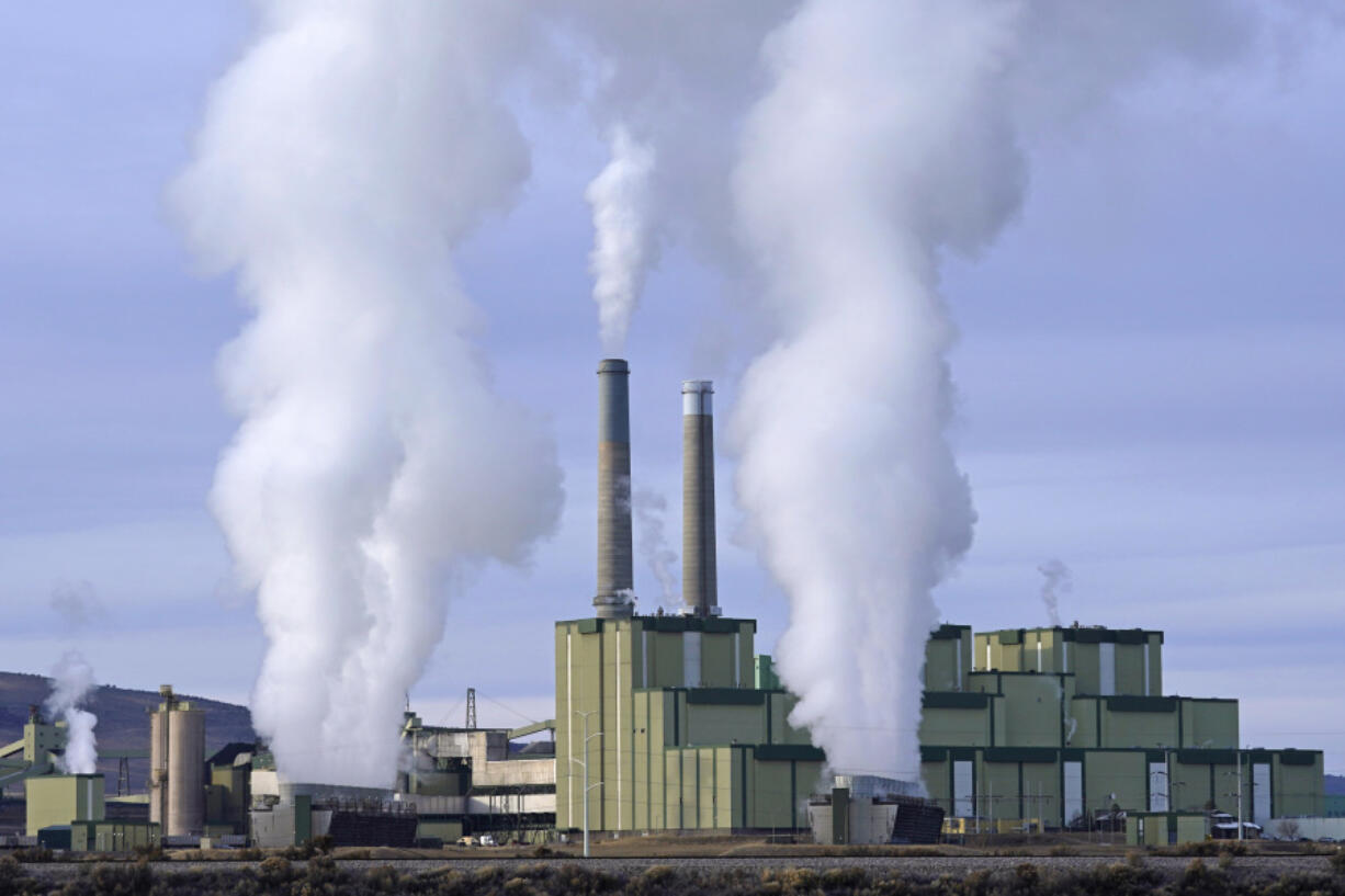 FILE - Steam billows from a coal-fired power plant Nov. 18, 2021, in Craig, Colo. A federal appeals court on Friday, July 19, 2024, allowed a Biden administration rule aimed at limiting planet-warming pollution from coal-fired power plants to remain in place, even as legal challenges continue. The EPA rule, announced in April, would force many coal-fired power plants to capture 90% of their carbon emissions or shut down within eight years.