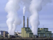 FILE - Steam billows from a coal-fired power plant Nov. 18, 2021, in Craig, Colo. A federal appeals court on Friday, July 19, 2024, allowed a Biden administration rule aimed at limiting planet-warming pollution from coal-fired power plants to remain in place, even as legal challenges continue. The EPA rule, announced in April, would force many coal-fired power plants to capture 90% of their carbon emissions or shut down within eight years.