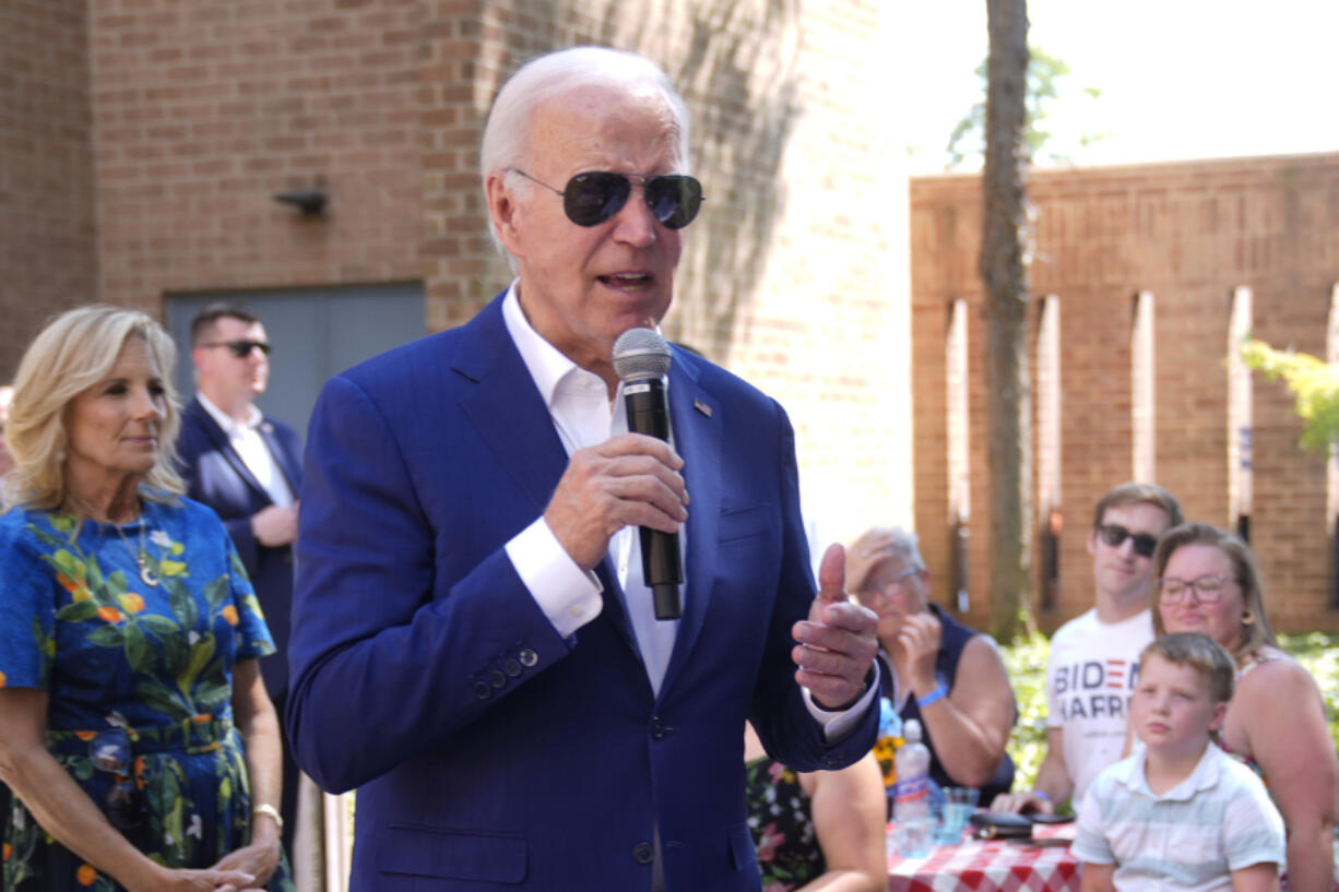 President Joe Biden speaks to supporters as first lady Jill Biden, left, looks on at a campaign rally in Harrisburg, Pa., on Sunday, July 7, 2024.