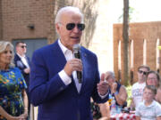 President Joe Biden speaks to supporters as first lady Jill Biden, left, looks on at a campaign rally in Harrisburg, Pa., on Sunday, July 7, 2024.