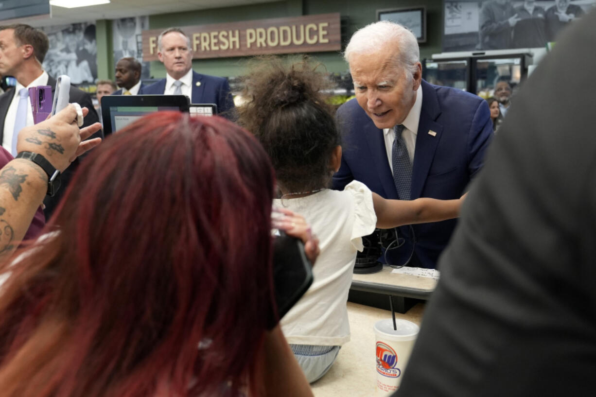 President Joe Biden greets people as he visits Mario&rsquo;s Westside Market in Las Vegas, Tuesday, July 16, 2024.