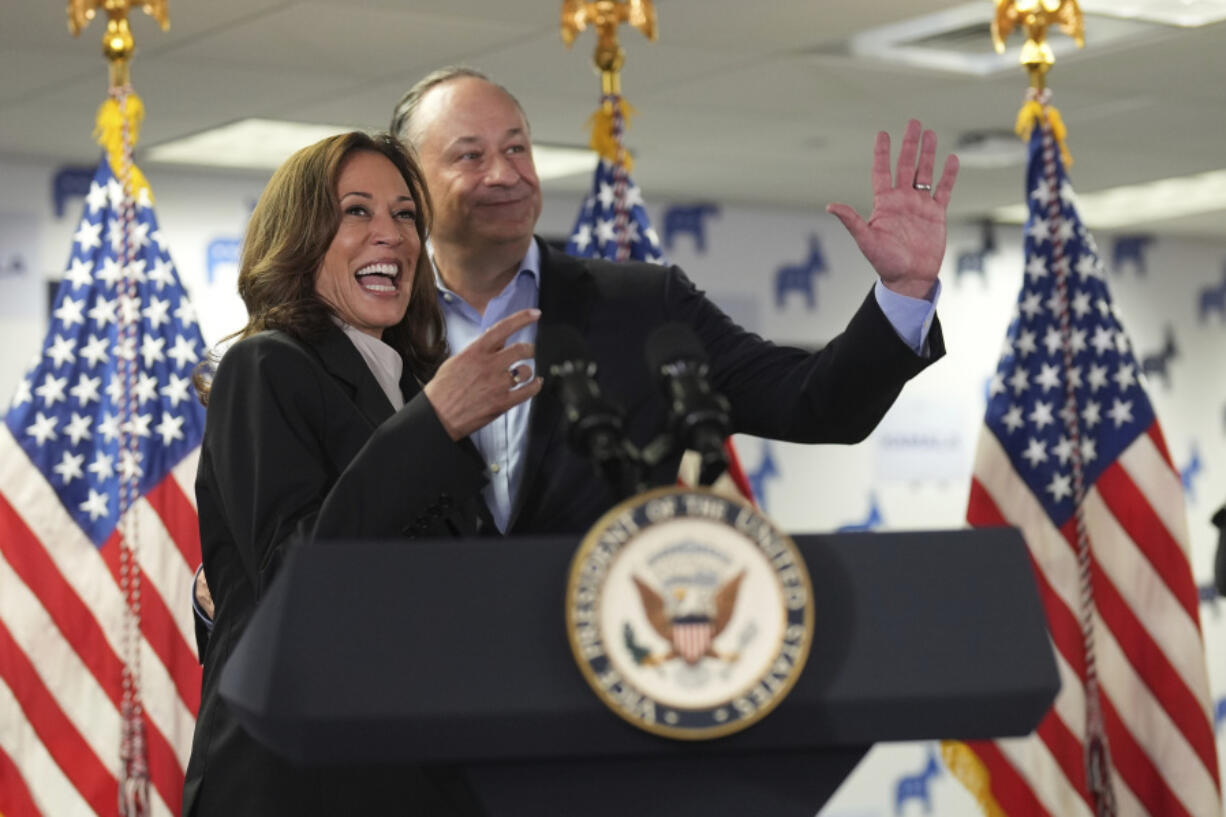 Vice President Kamala Harris, left, and second gentleman Doug Emhoff address staff at her campaign headquarters in Wilmington, Del., Monday, July 22, 2024.