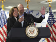 Vice President Kamala Harris, left, and second gentleman Doug Emhoff address staff at her campaign headquarters in Wilmington, Del., Monday, July 22, 2024.