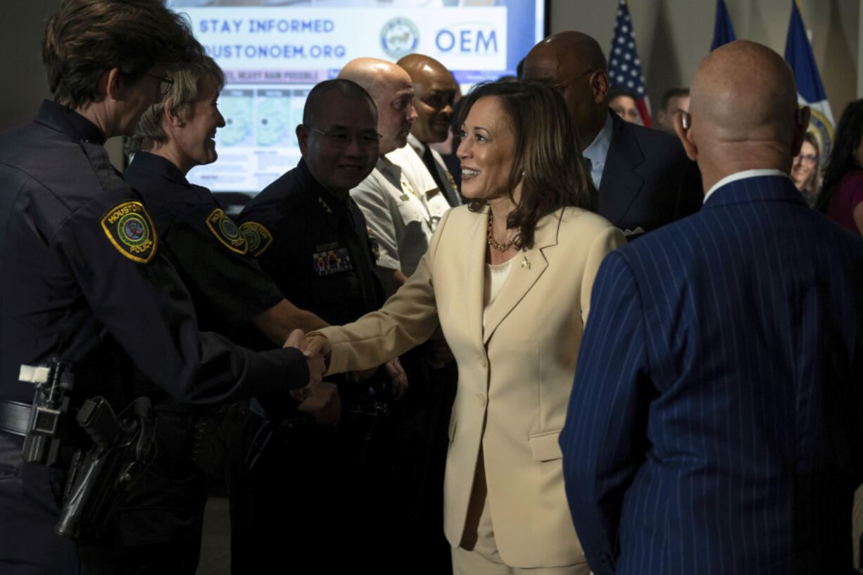 Democratic presidential candidate Vice President Kamala Harris greets first responders after receiving a briefing on Hurricane Beryl recovery efforts at the City of Houston Emergency Operation Center in Houston, Wednesday, July 24, 2024.