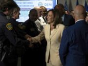 Democratic presidential candidate Vice President Kamala Harris greets first responders after receiving a briefing on Hurricane Beryl recovery efforts at the City of Houston Emergency Operation Center in Houston, Wednesday, July 24, 2024.
