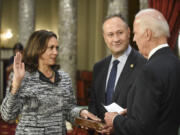FILE - Vice President Joe Biden administers the Senate oath of office to Sen. Kamala Harris, D-Calif., as her husband, Douglas Emhoff, holds the Bible during a a mock swearing in ceremony in the Old Senate Chamber on Capitol Hill in Washington, Jan. 3, 2017, as the 115th Congress begins. She&rsquo;s already broken barriers, and now Vice President Harris could soon become the first Black woman to head a major party&rsquo;s presidential ticket after President Joe Biden&rsquo;s ended his reelection bid. The 59-year-old Harris was endorsed by Biden on Sunday, July 21, after he stepped aside amid widespread concerns about the viability of his candidacy.