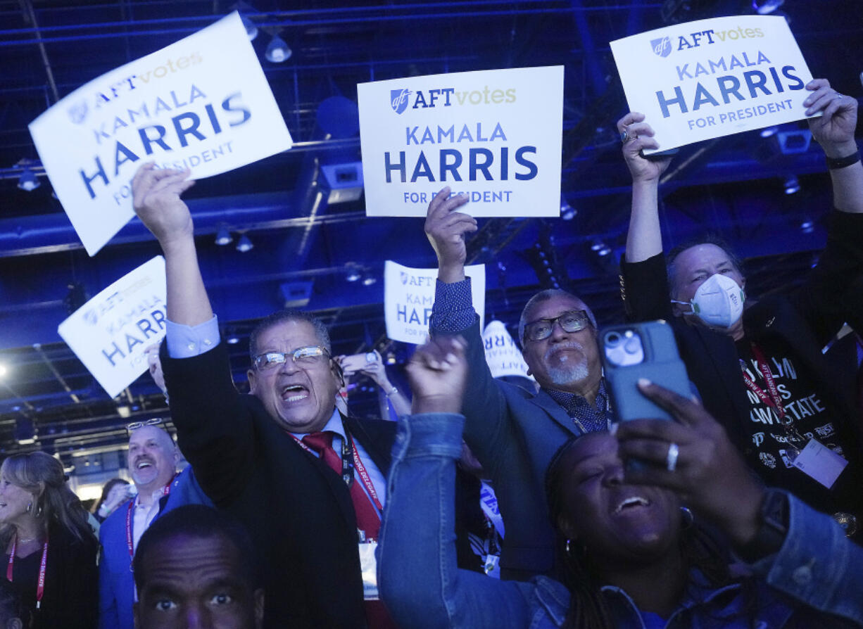 Members of the American Federation of Teachers react as Vice President Kamala Harris addresses the union at George R. Brown Convention Center on Thursday, July 25, 2024 in Houston.