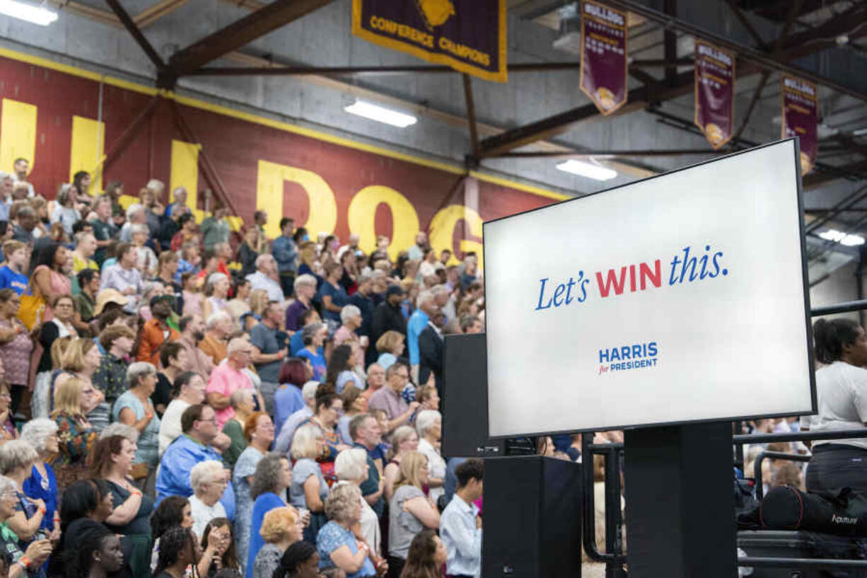 A digital screen displays Vice President Kamala Harris&rsquo; campaign as she campaigns for President as the presumptive Democratic candidate during an event at West Allis Central High School on Tuesday, July 23, 2024, in West Allis, Wis.