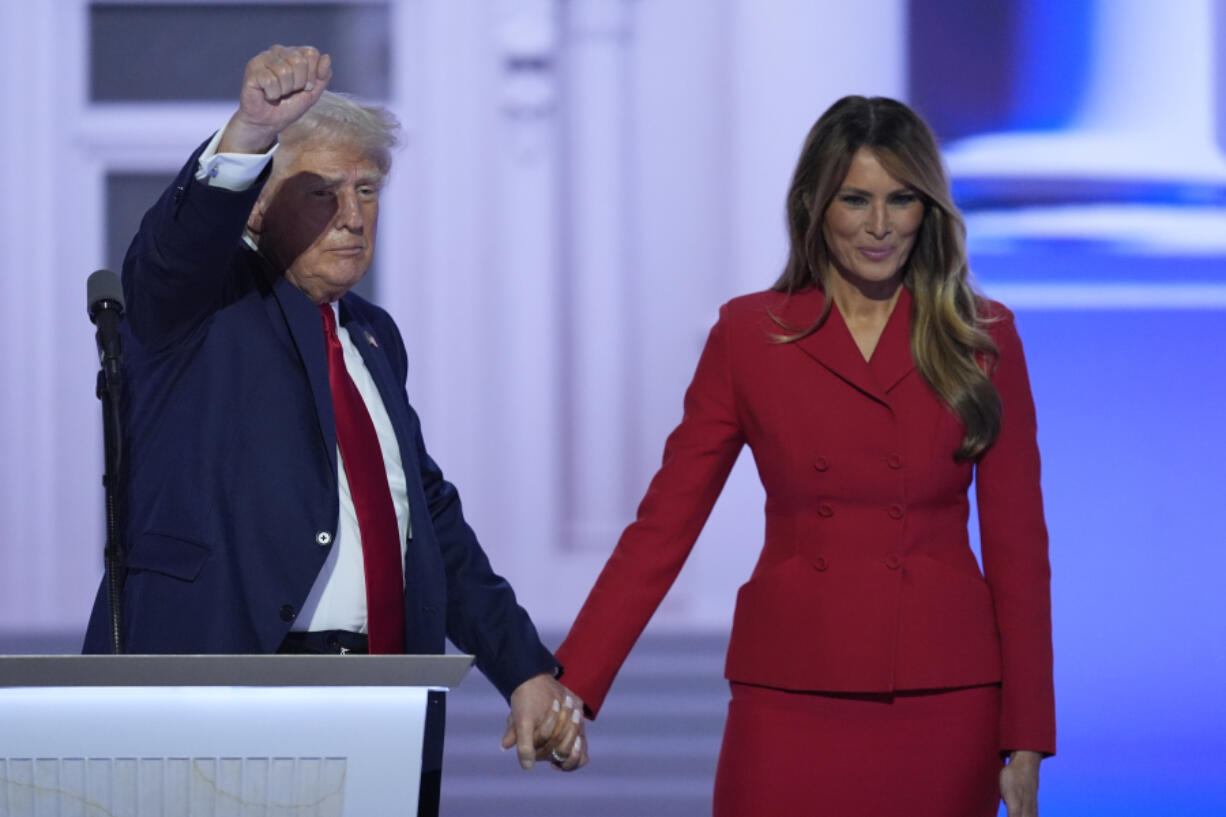 Republican presidential candidate former President Donald Trump is joined on stage by former first lady Melania Trump at the Republican National Convention Thursday, July 18, 2024, in Milwaukee. (AP Photo/J.