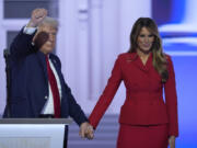 Republican presidential candidate former President Donald Trump is joined on stage by former first lady Melania Trump at the Republican National Convention Thursday, July 18, 2024, in Milwaukee. (AP Photo/J.