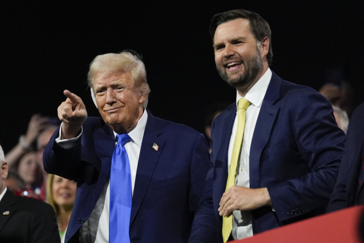 Republican presidential candidate former President Donald Trump and Republican vice presidential candidate Sen. JD Vance, R-Ohio, attend the 2024 Republican National Convention at the Fiserv Forum, Tuesday, July 16, 2024, in Milwaukee.