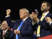 Republican presidential candidate former President Donald Trump and Republican vice presidential candidate Sen. JD Vance, R-Ohio, attend the 2024 Republican National Convention at the Fiserv Forum, Tuesday, July 16, 2024, in Milwaukee.