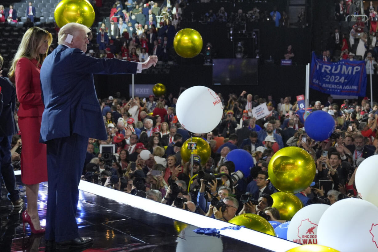 Republican presidential candidate former President Donald Trump stands on stage with former first lady Melania Trump during the final day of the Republican National Convention at the Fiserv Forum, Thursday, July 18, 2024, in Milwaukee.