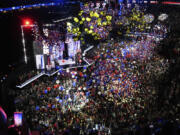 Republican presidential candidate and former president, Donald Trump, and Republican vice presidential candidate Sen. JD Vance, R-Ohio, watch with their families as the balloons fall during the final day of the Republican National Convention Thursday, July 18, 2024, in Milwaukee. (AP Photo/Nam Y.
