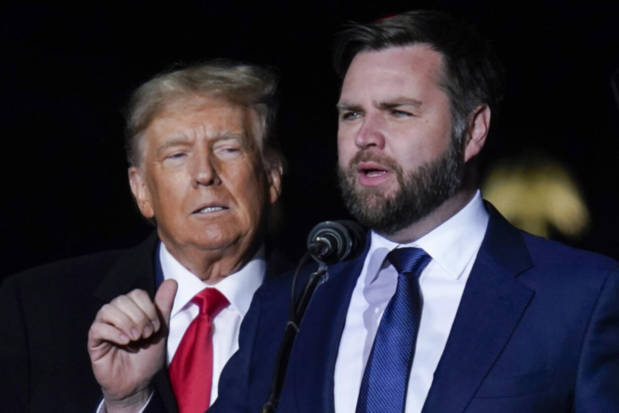 FILE - Republican Ohio Senate candidate JD Vance speaks as Republican presidential candidate former President Donald Trump listens at a campaign rally at Wright Bros. Aero Inc. at Dayton International Airport, Nov. 7, 2022, in Vandalia, Ohio. Trump says Vance will be his vice presidential pick for 2024. He says on his Truth Social Network that, &ldquo;After lengthy deliberation and thought, and considering the tremendous talents of many others, I have decided that the person best suited to assume the position of Vice President of the United States is Senator J.D.