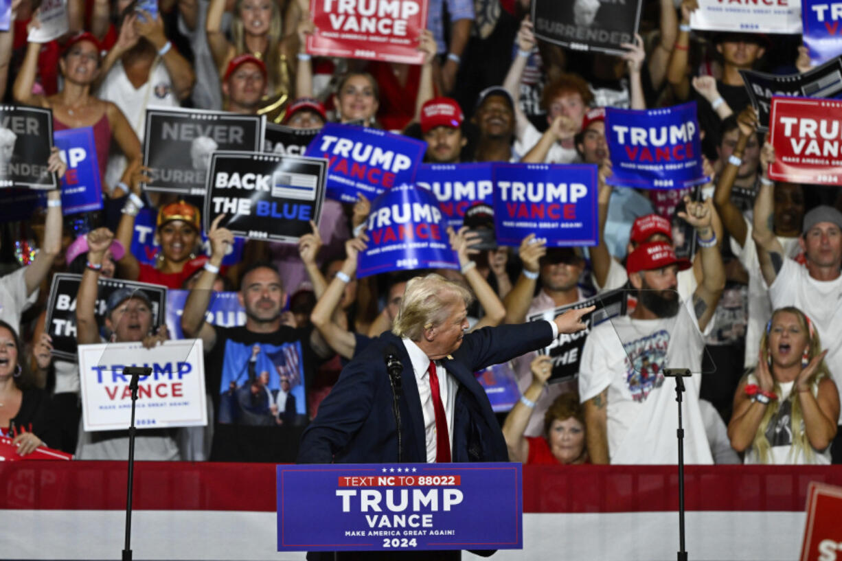 Republican presidential candidate former President Donald Trump points at supporters at a campaign rally in Charlotte, N.C., Wednesday, July 24, 2024.