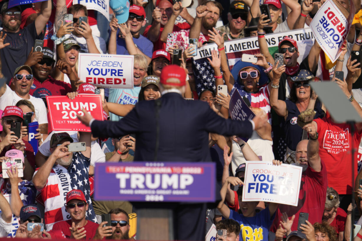 Republican presidential candidate former President Donald Trump addresses the crowd at a campaign event in Butler, Pa., on Saturday, July 13, 2024. (AP Photo/Gene J.