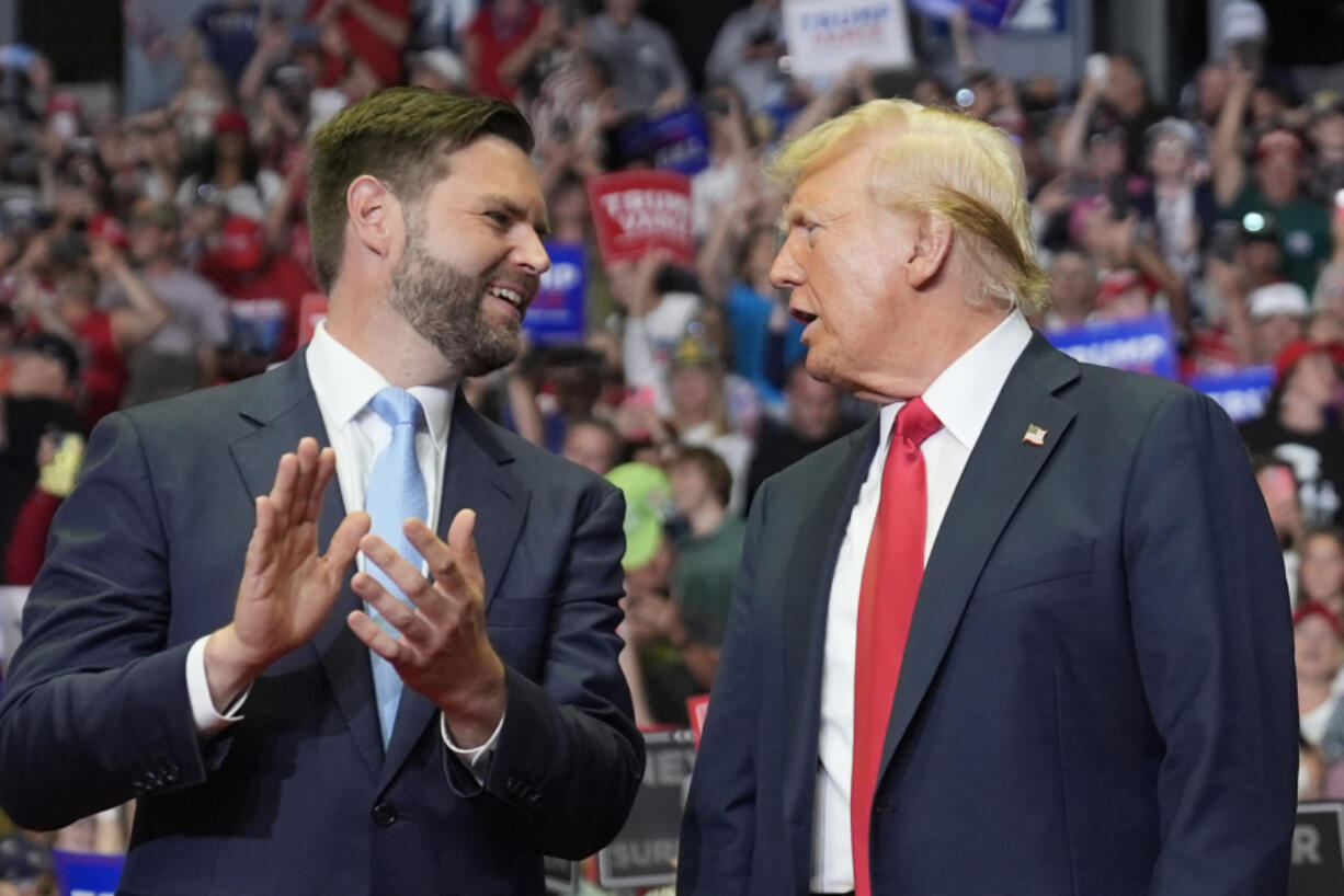 Republican presidential candidate former President Donald Trump and Republican vice presidential candidate Sen. JD Vance, R-Ohio, arrive a campaign rally, Saturday, July 20, 2024, in Grand Rapids, Mich.