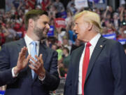 Republican presidential candidate former President Donald Trump and Republican vice presidential candidate Sen. JD Vance, R-Ohio, arrive a campaign rally, Saturday, July 20, 2024, in Grand Rapids, Mich.