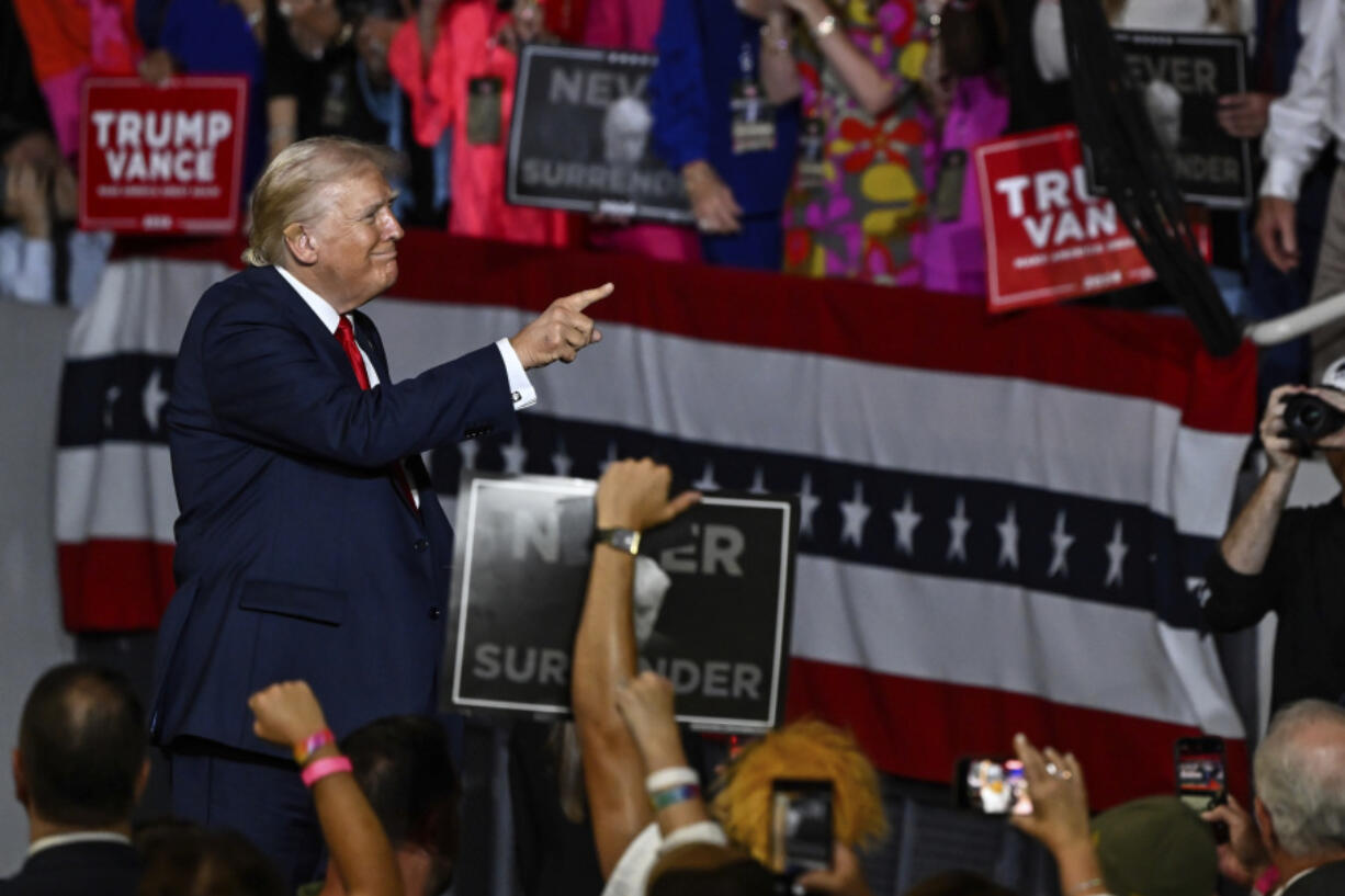 Republican presidential candidate former President Donald Trump points at supporters at a campaign rally in Charlotte, N.C., Wednesday, July 24, 2024.