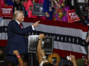 Republican presidential candidate former President Donald Trump points at supporters at a campaign rally in Charlotte, N.C., Wednesday, July 24, 2024.