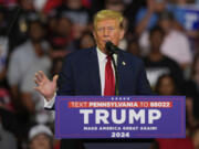 FILE - Republican presidential candidate former President Donald Trump speaks at a campaign rally, June 22, 2024, in Philadelphia. Trump is seeking to distance himself from a plan for a massive overhaul of the federal government drafted by some of his administration officials. Some of these men are expected to take high-level roles if the Republican presumptive nominee is elected back into the White House.