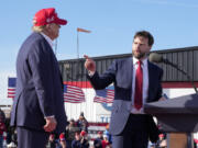 FILE - Sen. J.D. Vance, R-Ohio, right, points toward Republican presidential candidate former President Donald Trump at a campaign rally on March 16, 2024, in Vandalia, Ohio. Vance sharply criticized Trump during the 2016 election cycle, before changing course and embracing the former president. Vance is now one of Trump&rsquo;s fiercest allies and defenders and among those short-listed to be Trump&rsquo;s vice presidential pick.