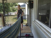 Amanda Bailey, 35, stands on her front porch on Friday, June 21, 2024, in Middletown, Ohio. This house, where Bailey and her family live, is the same house where &ldquo;Hillbilly Elegy&rdquo; author Sen. J.D. Vance, R-Ohio, grew up.