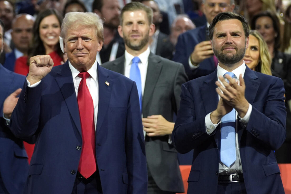 FILE - Republican presidential candidate former President Donald Trump, left, and Republican vice presidential candidate Sen. JD Vance, R-Ohio, attend the Republican National Convention, July 15, 2024, in Milwaukee. Vice President Kamala Harris and her Democratic allies are increasingly branding Trump and Vance as &ldquo;weird.&rdquo; Democrats are applying the label with gusto in interviews and online.