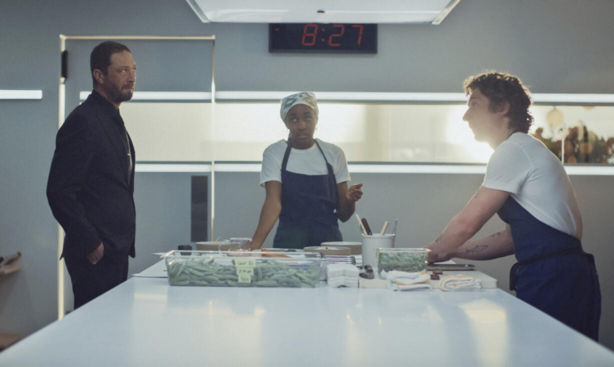 This image released by FX shows Ebon Moss-Bachrach, from left, Ayo Edebiri and Jeremy Allen White in a scene from &ldquo;The Bear.&rdquo; (FX via AP)