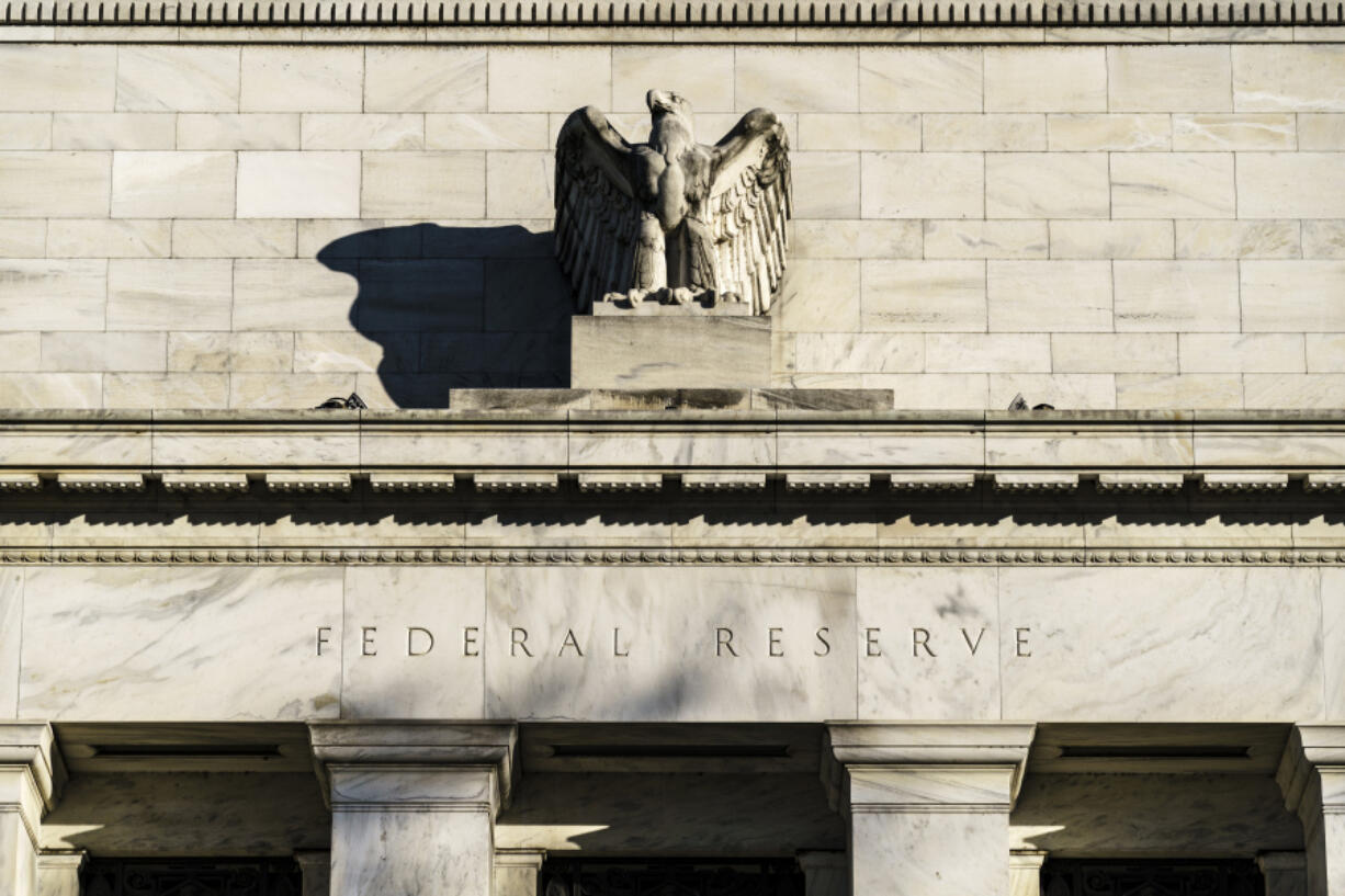 FILE - The Federal Reserve is seen in Washington, on Nov. 16, 2020. The Federal Reserve is expected to signal this week that it will likely reduce borrowing costs as soon as September 2024. (AP Photo/J.