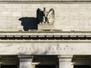 FILE - The Federal Reserve is seen in Washington, on Nov. 16, 2020. The Federal Reserve is expected to signal this week that it will likely reduce borrowing costs as soon as September 2024. (AP Photo/J.