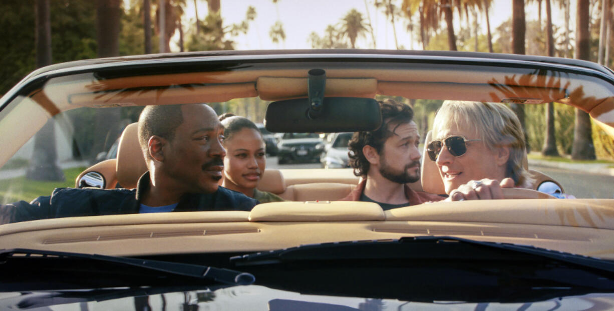 his image released by Netflix shows Eddie Murphy, from left, Taylour Paige, Joseph Gordon-Levitt and Bronson Pinchot in &ldquo;Beverly Hills Cop: Axel F.&rdquo; (Netflix via AP)