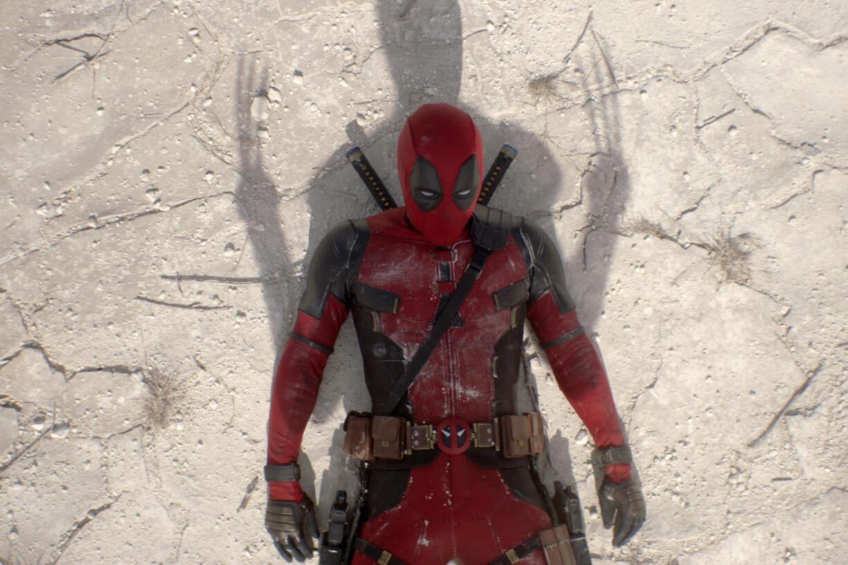 This image released by 20th Century Studios/Marvel Studios shows Ryan Reynolds as Deadpool/Wade Wilson in a scene from &quot;Deadpool &amp; Wolverine.&quot; (20th Century Studios/Marvel Studios via AP)