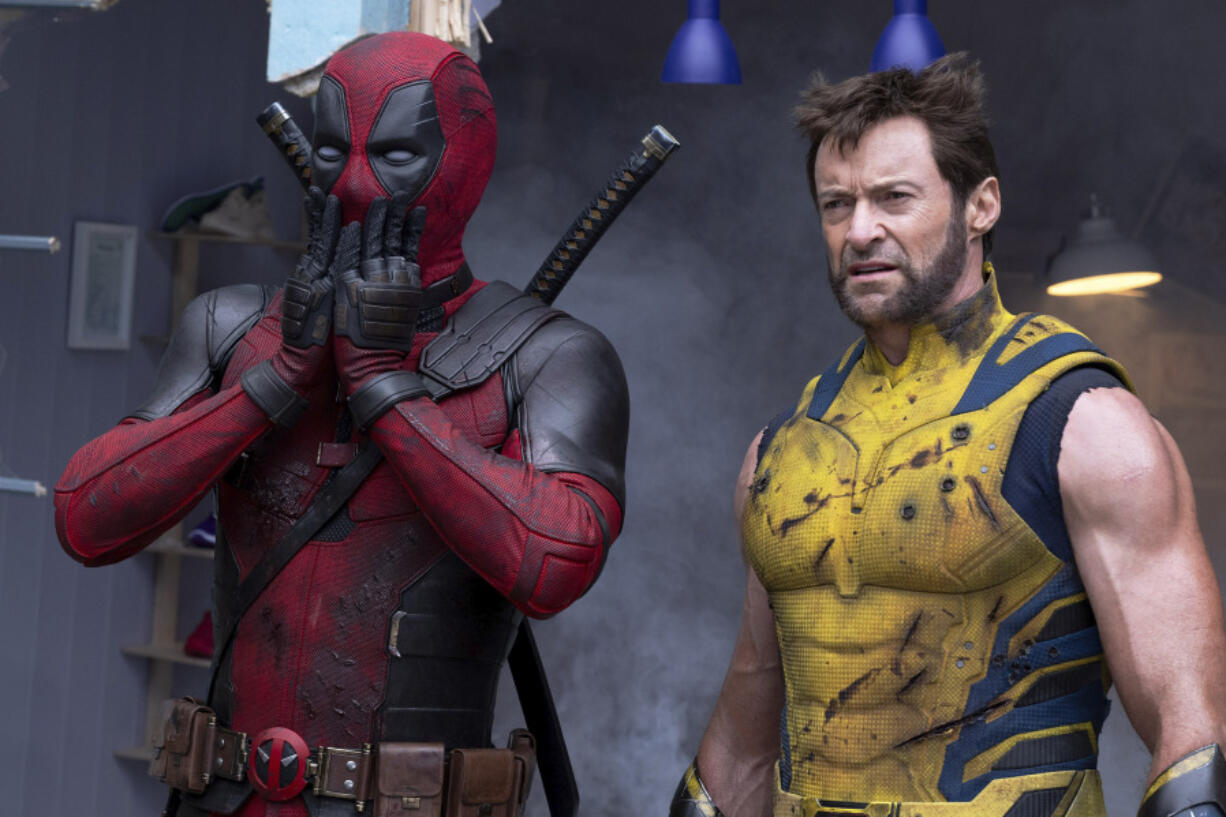 This image released by 20th Century Studios/Marvel Studios shows Ryan Reynolds as Deadpool/Wade Wilson, left, and Hugh Jackman as Wolverine/Logan in a scene from &ldquo;Deadpool &amp; Wolverine.&rdquo; (20th Century Studios/Marvel Studios via AP)