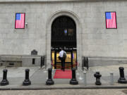 A man enters the New York Stock Exchange on Wednesday, July 17, 2024, in New York. Global stocks have mostly fallen, with shares in London declining after data showed the inflation rate remained steady at the Bank of England&rsquo;s 2% target in June.