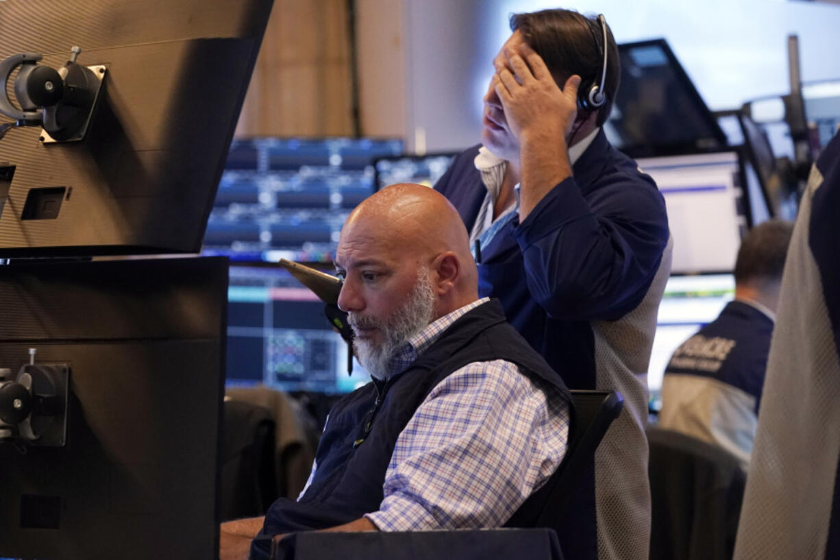 A pair of traders work on the floor of the New York Stock Exchange, Monday, July 22, 2024. U.S.