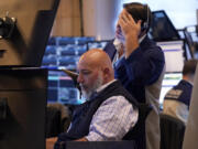 A pair of traders work on the floor of the New York Stock Exchange, Monday, July 22, 2024. U.S.